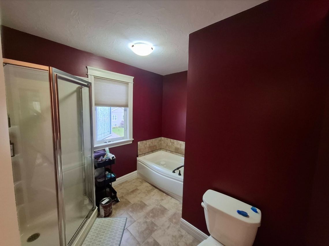 Same bathroom with burgundy walls, photographed from a slightly different viewpoint